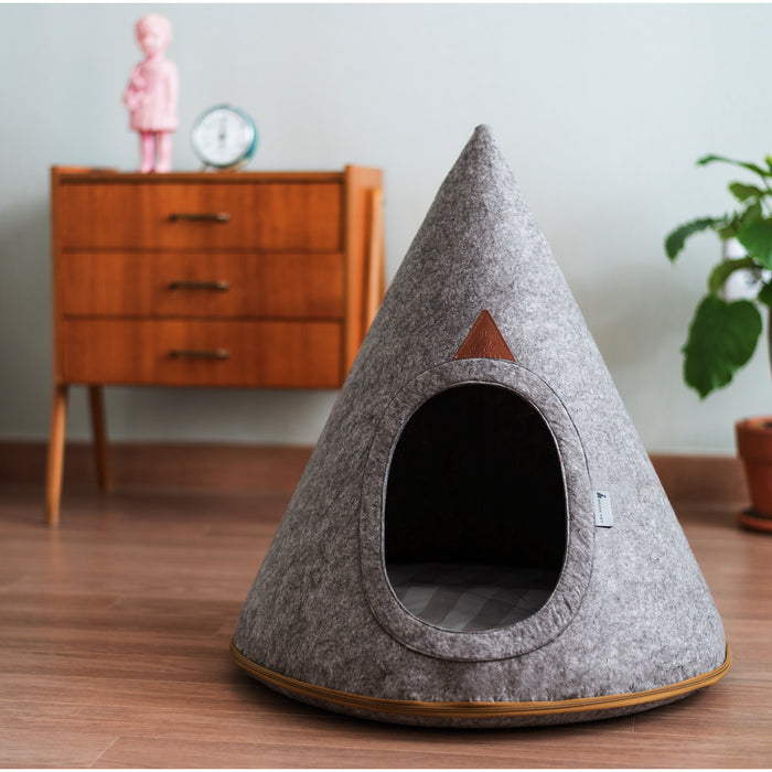 Large Pet Cave by Nooee Pet in Grey, with a brown lined zipper, situated in a living room on a wood floor