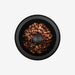 Black bowl with pet food on a white background