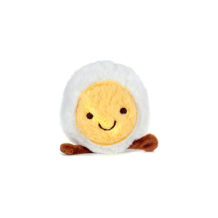 Plush toy resembling a character with a white face, yellow body, and brown feet on a white background