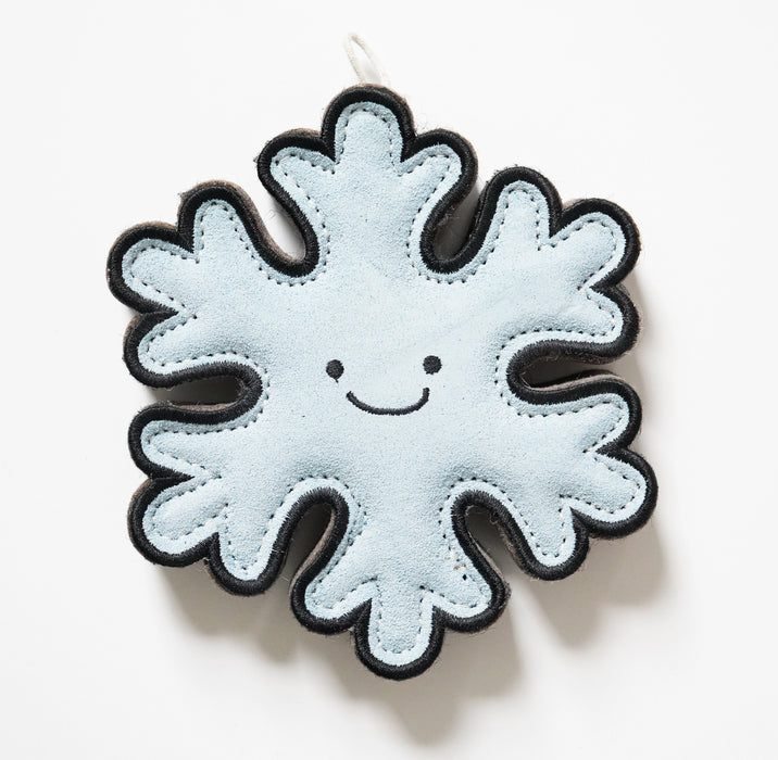 Felt snowflake ornament with a smiling face on a white background