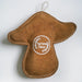 A brown suede mushroom-shaped ornament with white stitching and a circular white embroidered logo reading 'Aurora Pensa' in the center, shown against a plain white background.