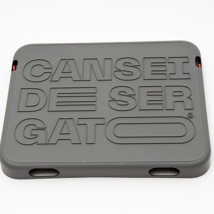 Gray plastic component with embossed text on a white background
