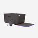 Black litter box with a purple mat on a light gray background