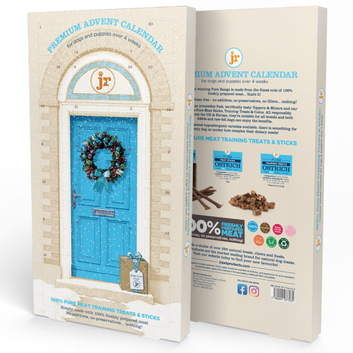 A boxed premium advent calendar product shown from the front and back. The box features a cream brick-patterned background with a bright blue door illustration, a wreath, and branding for 'JF'.