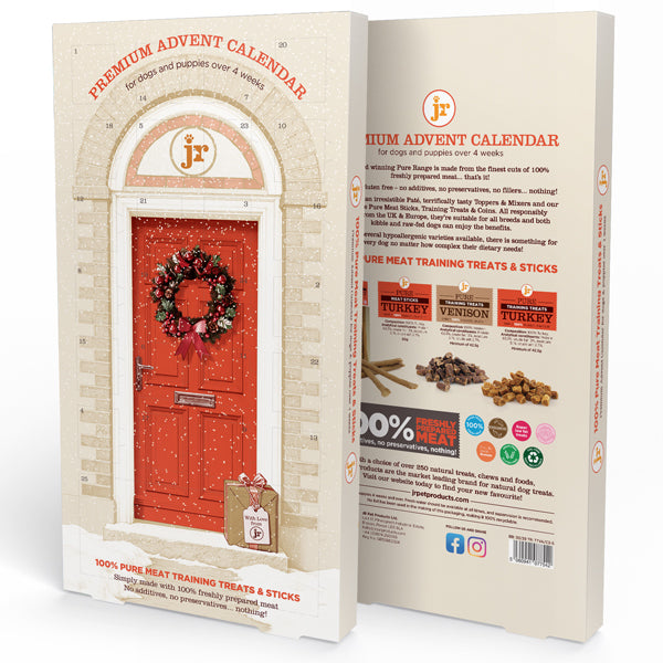 A boxed pet product shown from the front and back, featuring a cream-colored package with a large red front door illustration adorned with a wreath. The front reads 'Premium Advent Calendar' and shows a small gift bag graphic.