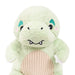 Green plush toy t-rex design on a white background