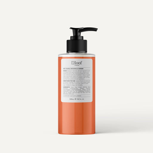 Orange bottle with black pump on a white background