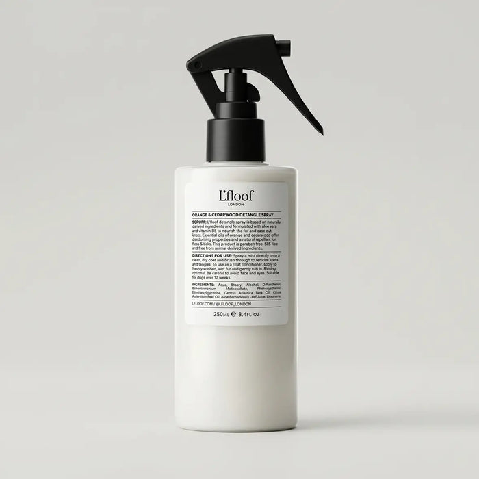 L'floof hair product bottle with a black spray nozzle on a light gray background