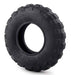Black tire with tread pattern on a white background