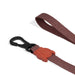 Brown dog leash with a black clip and red dog-shaped clip on a white background
