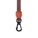 Brown dog leash with a black clip on a white background