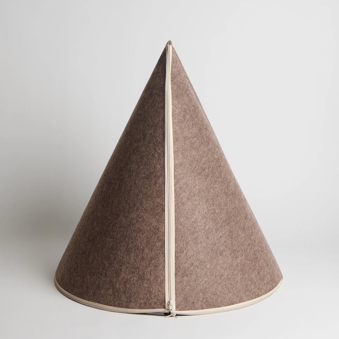 A cone-shaped felt object in a warm taupe-brown color, featuring a light beige vertical zipper running down the center seam, set against a plain light gray background.