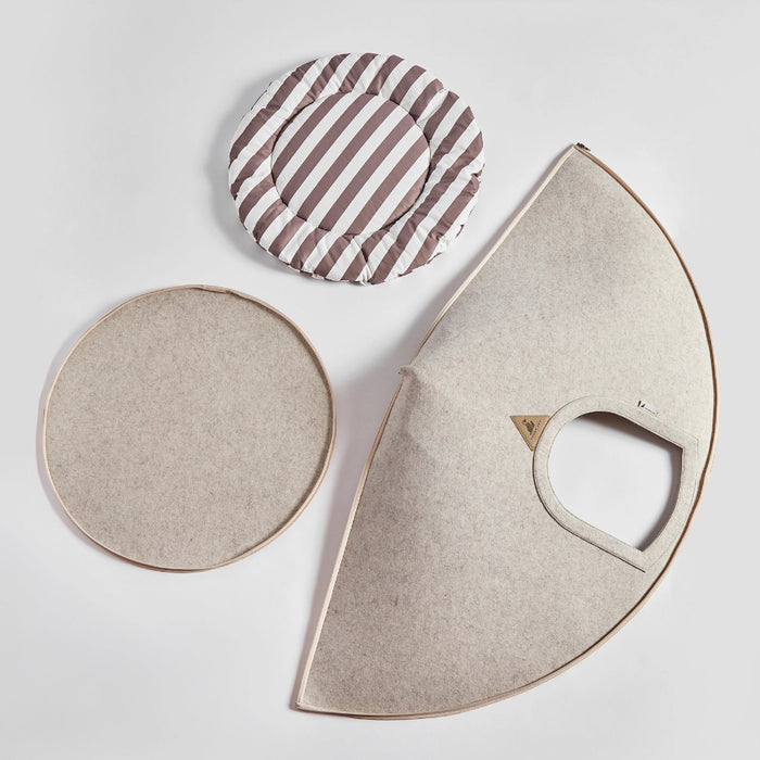Three fabric cushions with different shapes and patterns on a light background