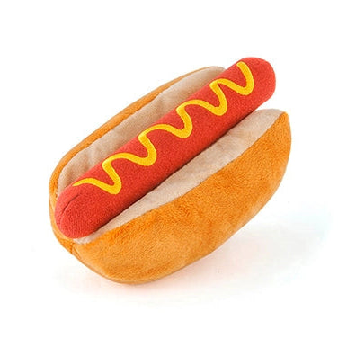 Plush hot dog toy with mustard on a white background