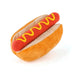 Plush hot dog toy with mustard on a white background