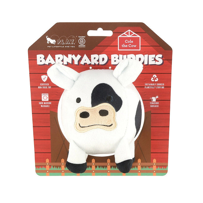 Plush cow toy in packaging with 'Barnyard Buddies' branding on a white background