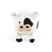 A small plush cow toy with a white body, black spots, and a beige snout, photographed against a plain white background.