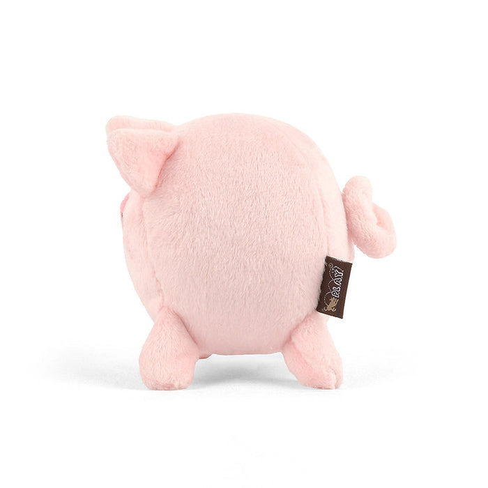 Pink plush pig toy with a tag on a white background