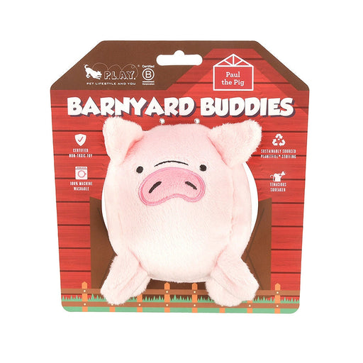 A pink plush pig toy packaged on a red barn-themed backing card labeled 'Barnyard Buddies' and 'Pull the Pig.'