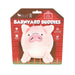 A pink plush pig toy packaged on a red barn-themed backing card labeled 'Barnyard Buddies' and 'Pull the Pig.'
