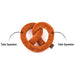 A plush pretzel-shaped tube squeaker toy in brown faux fur with white faux-seed details, shown on a white background with two callout arrows and text reading 'Tube Squeaker'.