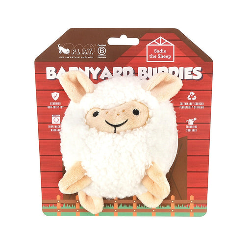 Plush lamb toy in front of a Barnyard Buddies packaging on a white background