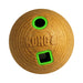 A Kong brand dog toy ball in a textured tan material, featuring a circular hole with a bright green rim and a square slot with a matching green border, on a plain white background.