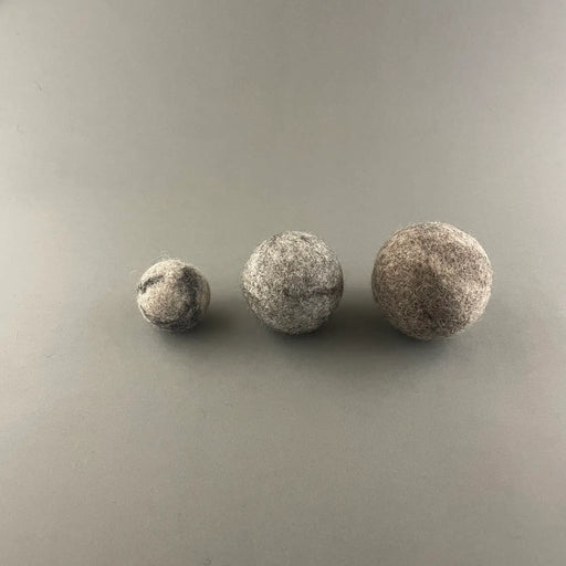 wool balls on a grey backround