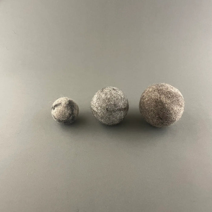 wool balls on a grey backround