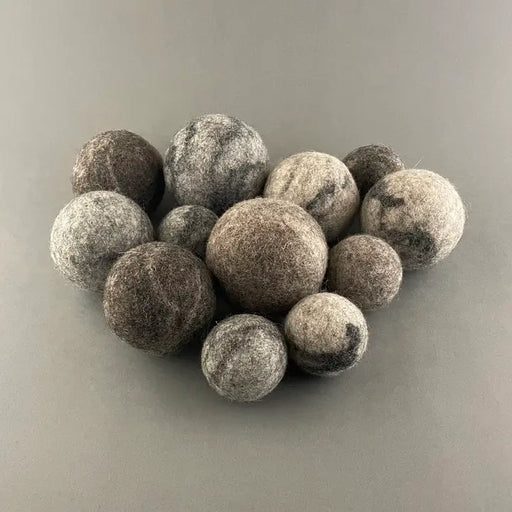 wool balls on a grey backround