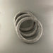 Three gray rings stacked on a gray background