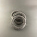 Three gray felt rings stacked on a light gray background