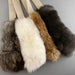 fur rope toys on a gray background