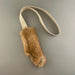 fur rope toy on a gray background