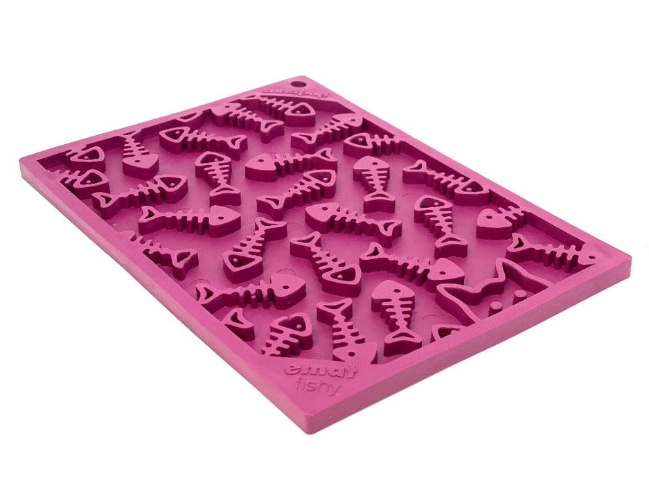 Mauve silicone mold with fish bone and heart shapes on a white background