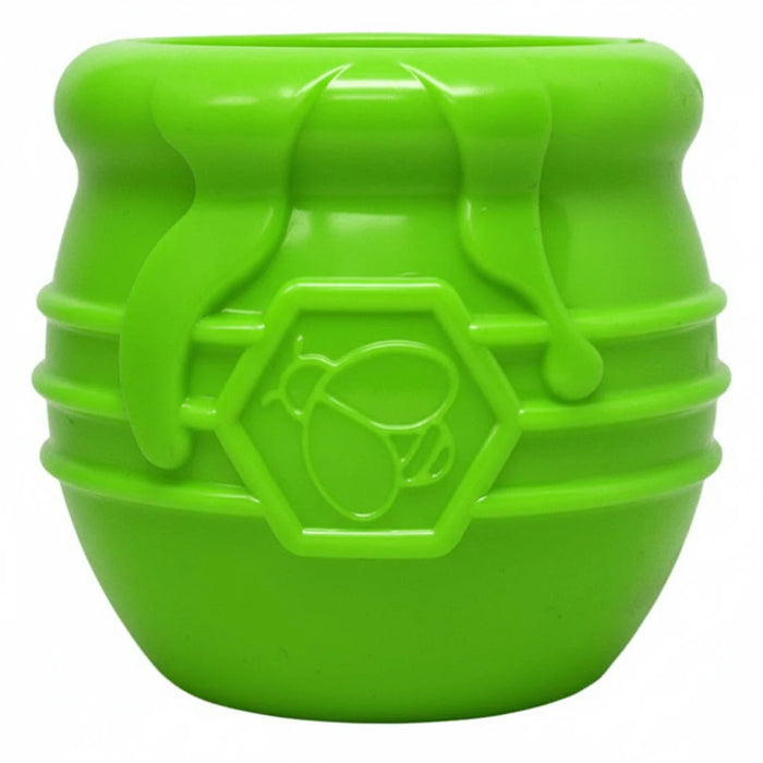 Green plastic container with a honeycomb design on a white background