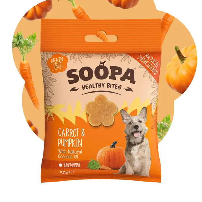 A package of Soopa Healthy Bites dog treats, specifically Carrot & Pumpkin flavor. The packaging is orange and beige with illustrations of a dog, pumpkins, and carrots.