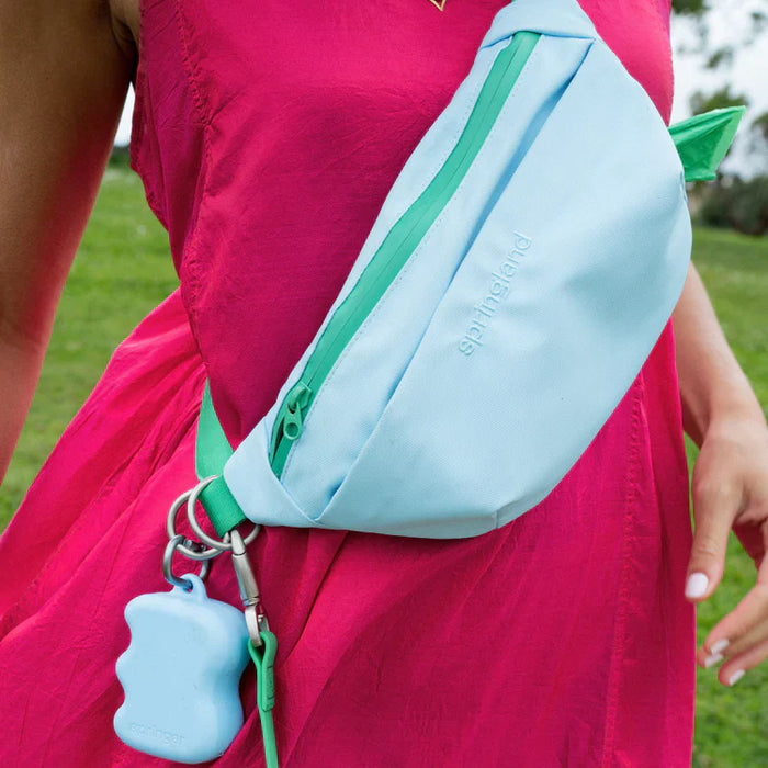 woman wearing blue and green bag