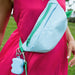 woman wearing blue and green bag