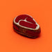 Felted toy resembling a steak on an orange background