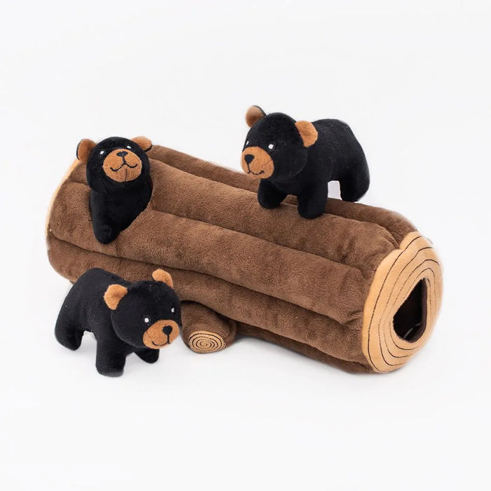 Dog toy with plush bear figures and a brown log on a white background