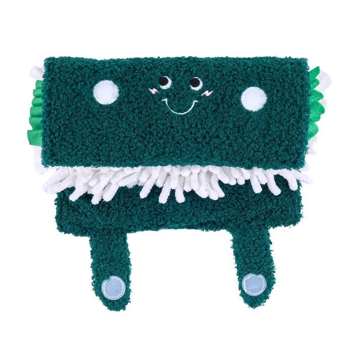 Green plush toy with a happy face on a white background