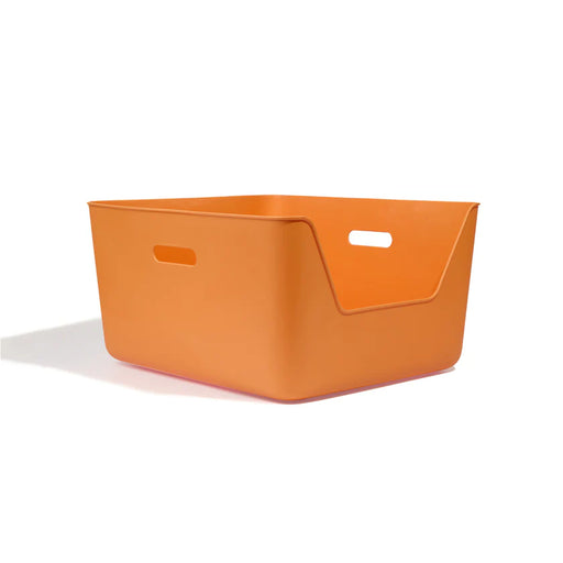 Orange storage bin on a white background