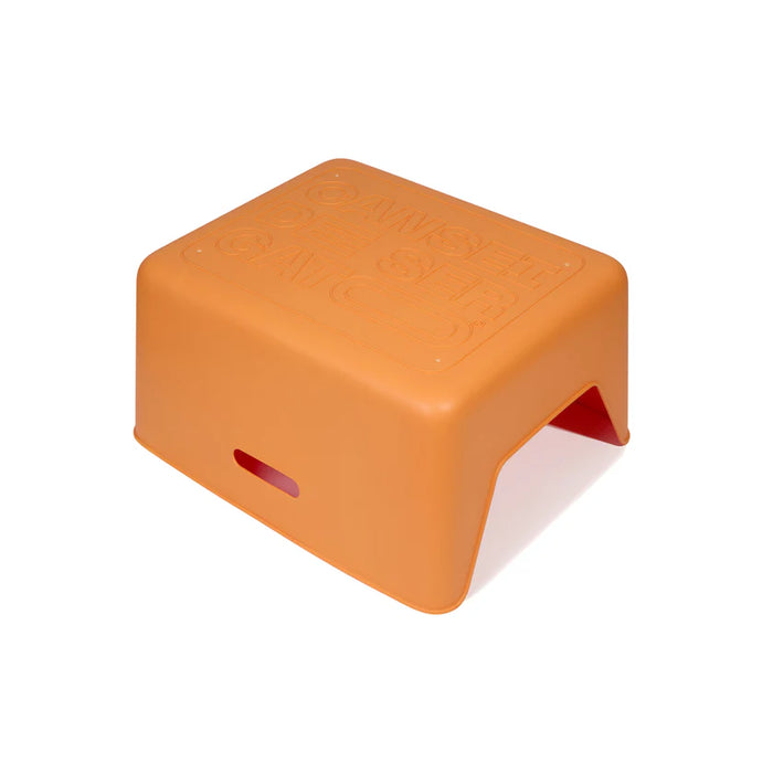 Orange step stool on a white background