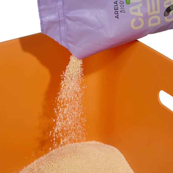 Purple bag labeled 'Caffè de Caffè' pouring a white powder into an orange container.