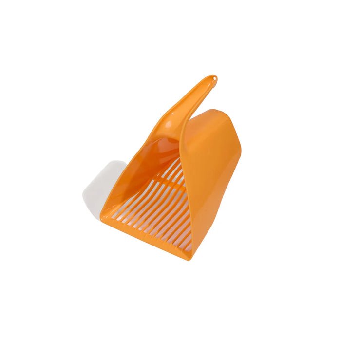 Orange scoop and white comb on a white background