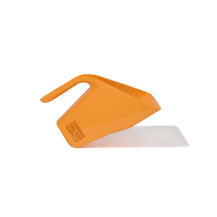 Orange plastic scoop with a white component on a white background