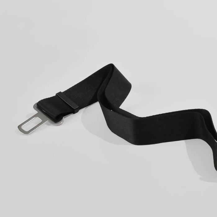 Black car seat belt on a light grey background