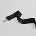 Black car seat belt on a light grey background