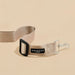 Beige dog leash with black clip and COCOPUP London label on a beige background